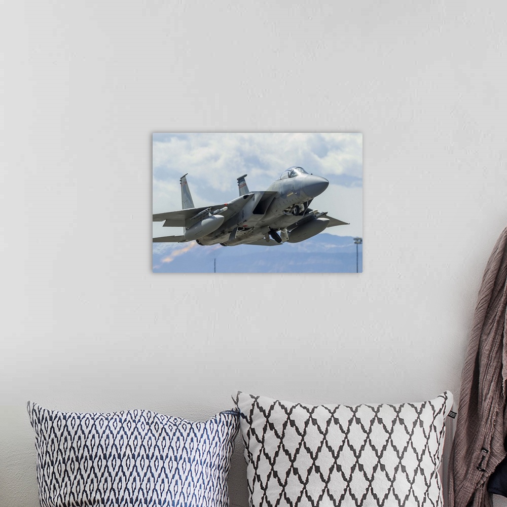 A bohemian room featuring A U.S. Air Force F-15C Eagle taking off from Nellis Air Force Base, Nevada.