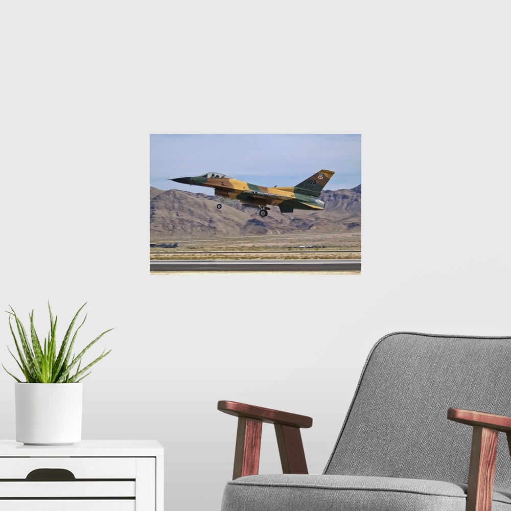 A modern room featuring A U.S. Air Force F-16 of the 64th Agressor Squadron taking off from Nellis Air Force Base, Nevada.
