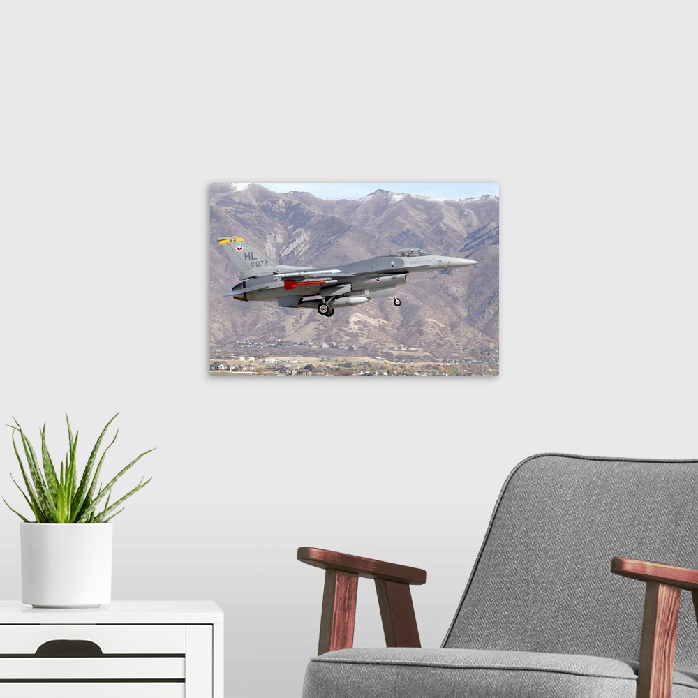 A modern room featuring A U.S. Air Force F-16C Fighting Falcon landing at the end of a training mission at Hill Air Force...