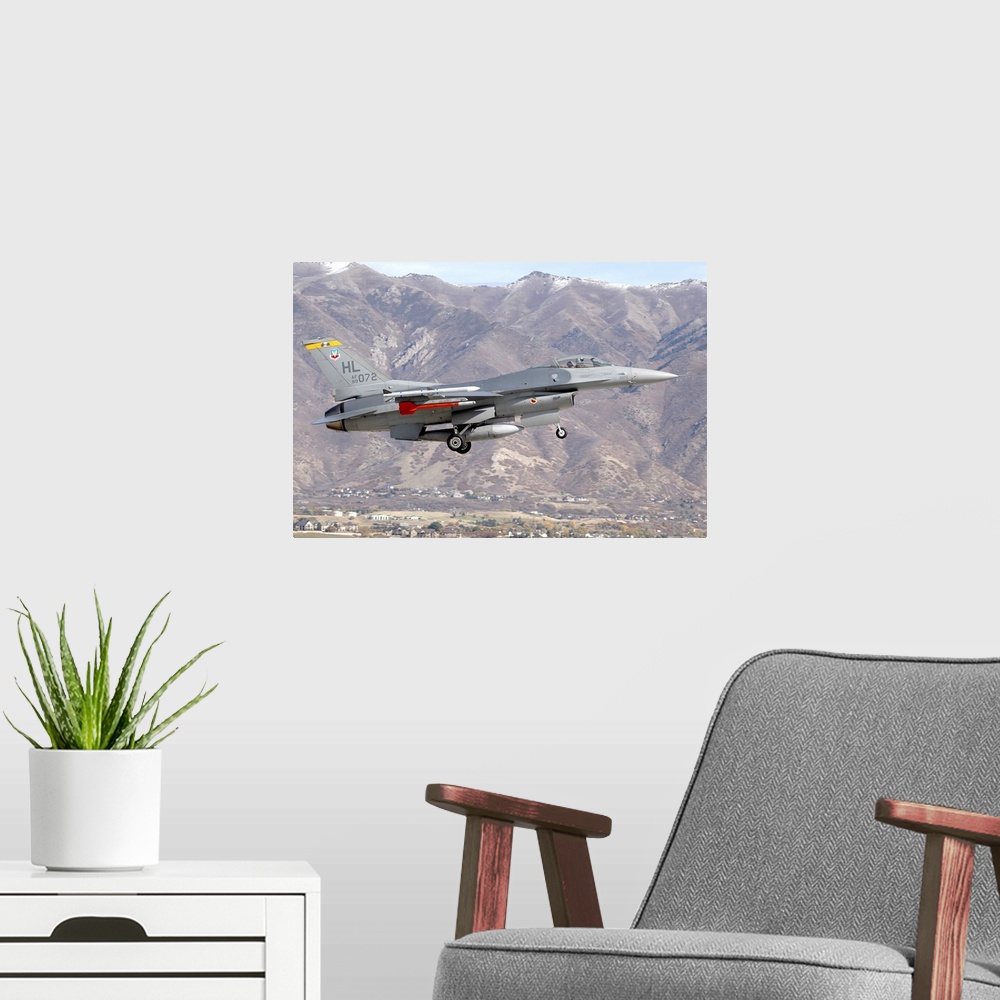 A modern room featuring A U.S. Air Force F-16C Fighting Falcon landing at the end of a training mission at Hill Air Force...