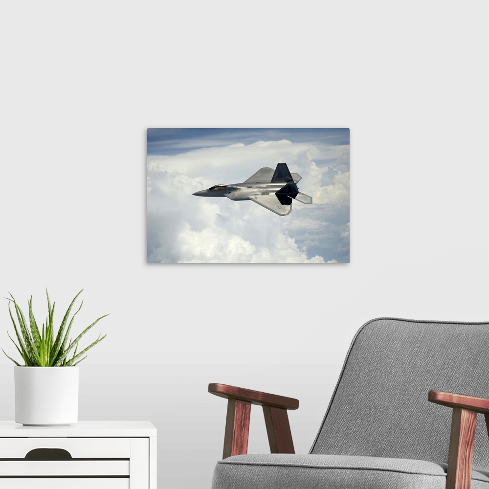 A modern room featuring July 10, 2012 - A U.S. Air Force F-22 Raptor aircraft in flight over Maryland.