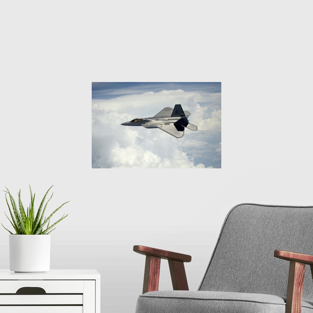 A modern room featuring July 10, 2012 - A U.S. Air Force F-22 Raptor aircraft in flight over Maryland.