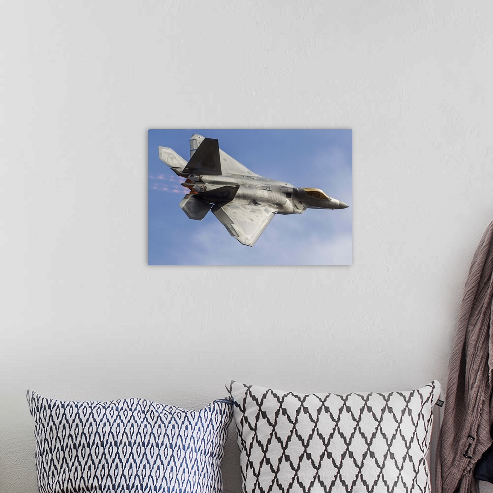 A bohemian room featuring A U.S. Air Force F-22 Raptor makes a fast flyby at Stead Field, Reno, Nevada.