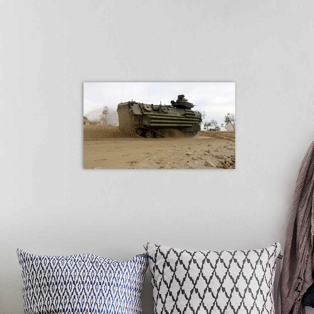 A bohemian room featuring A U.S. Marine Amphibious Assault Vehicle moves to its objective.