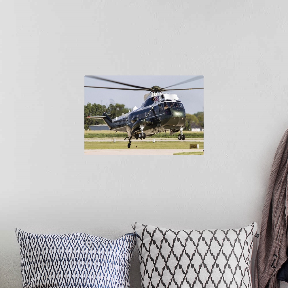 A bohemian room featuring A U.S. Marine Corps VH-3D transport helicopter lands at DuPage County Airport, Illinois.