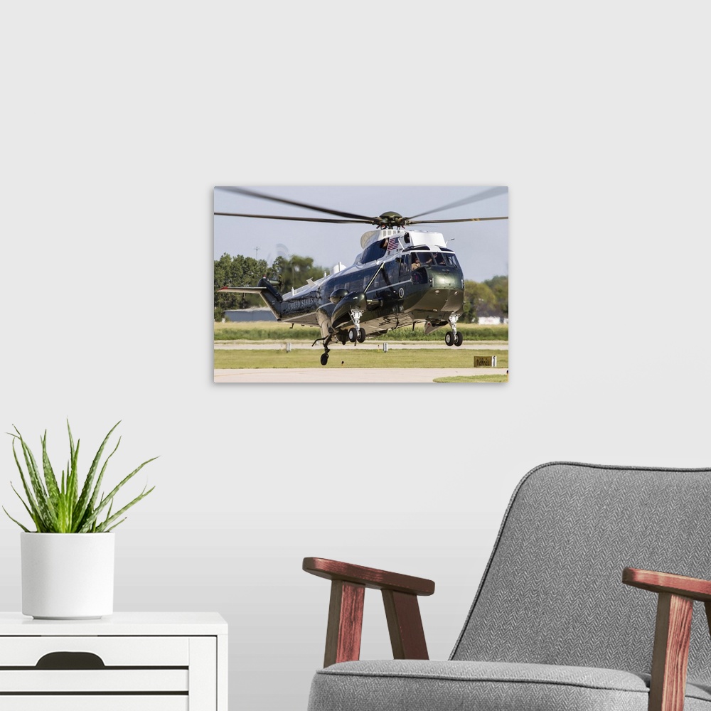 A modern room featuring A U.S. Marine Corps VH-3D transport helicopter lands at DuPage County Airport, Illinois.