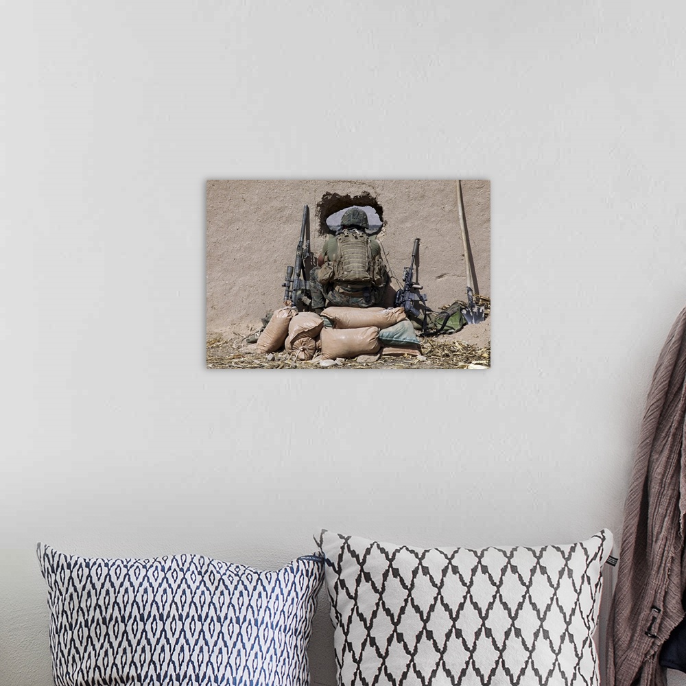 A bohemian room featuring October 14, 2010 - A U.S. Marine sniper observes his sector at a patrol base near Sangin, Afghani...