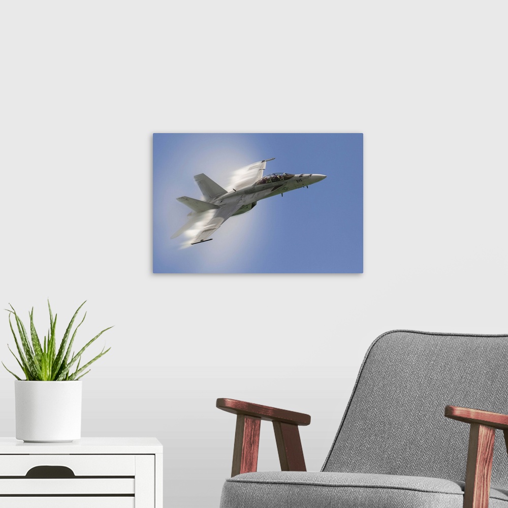 A modern room featuring A U.S. Navy F/A-18F performs a fast pass over Chicago, Illinois.