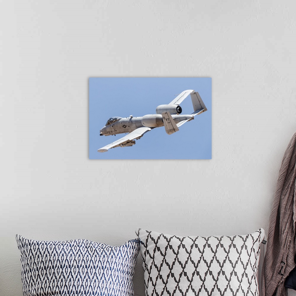 A bohemian room featuring A U.S. Air Force A-10 Thunderbolt II in flight.