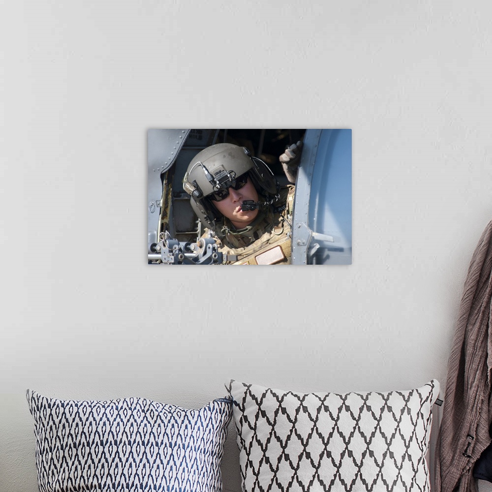 A bohemian room featuring San Diego, November 7, 2012 - A U.S. Air Force Airman peers out the side of a HH-60 Pave Hawk hel...