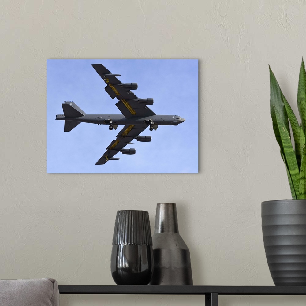 A modern room featuring A U.S. Air Force B-52G Stratofortress prepares for landing.