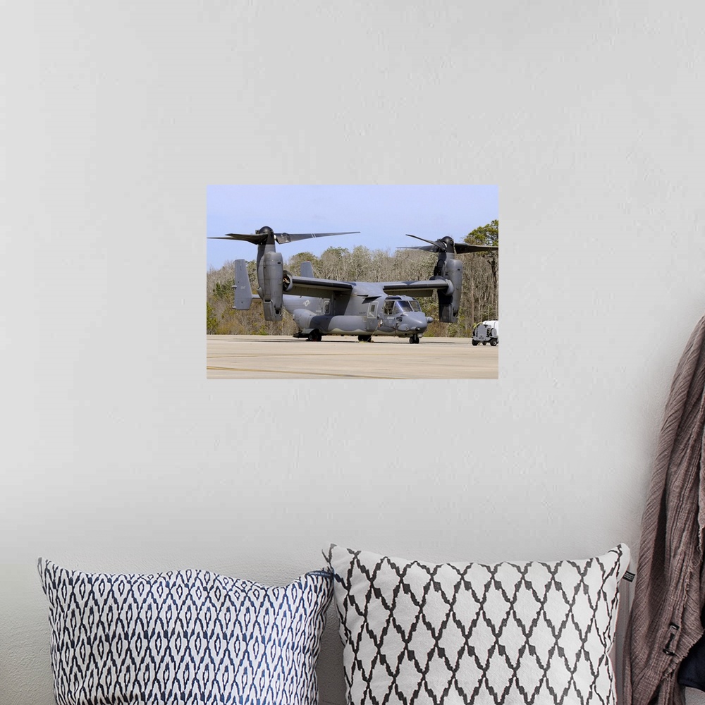A bohemian room featuring A U.S. Air Force CV-22B Osprey   on the ramp at Hurlburt Field, Florida.