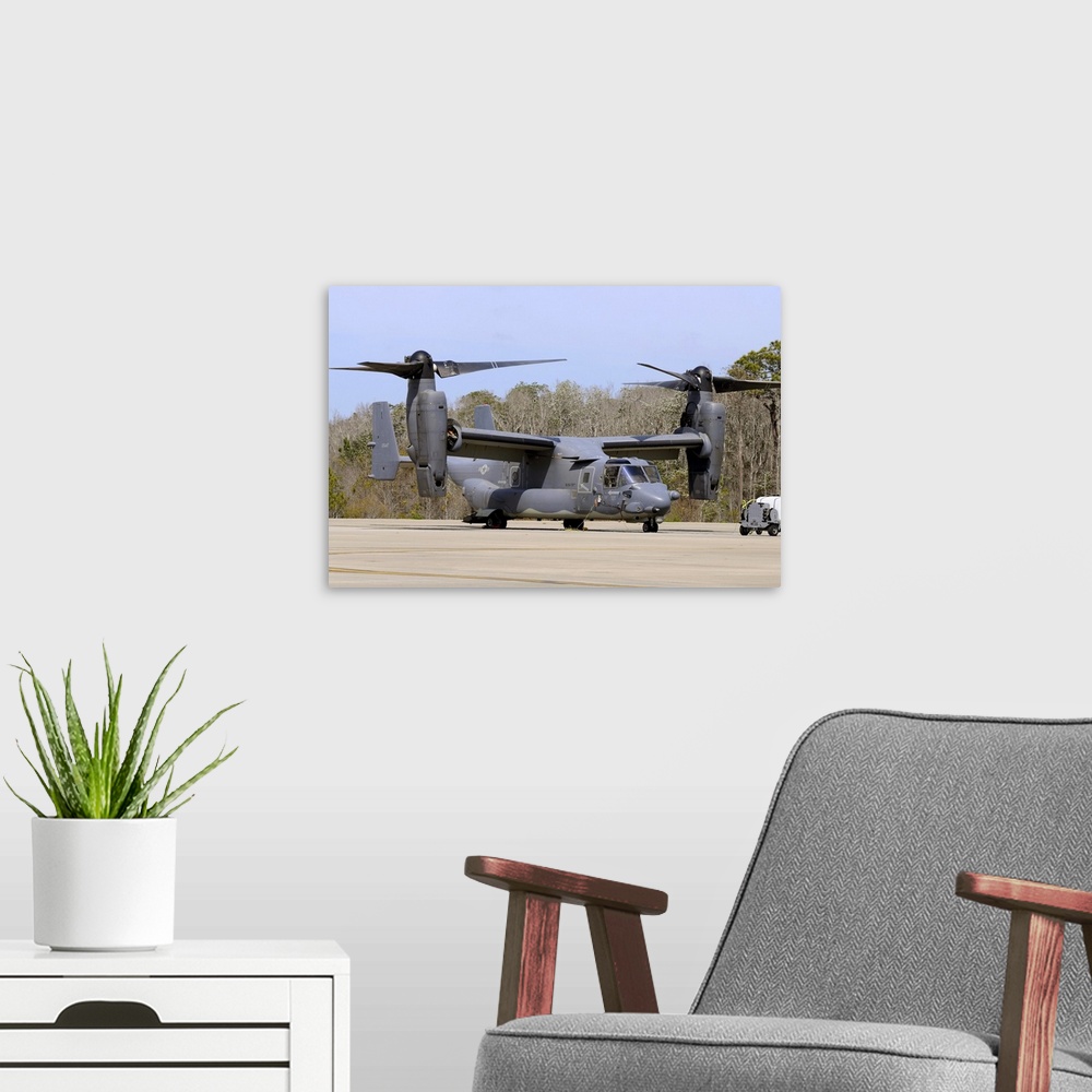 A modern room featuring A U.S. Air Force CV-22B Osprey   on the ramp at Hurlburt Field, Florida.