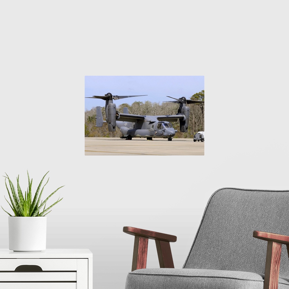 A modern room featuring A U.S. Air Force CV-22B Osprey   on the ramp at Hurlburt Field, Florida.