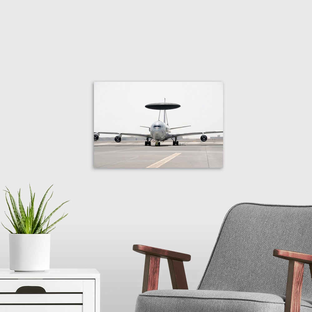 A modern room featuring A U.S. Air Force E-3 Sentry airborne warning and control aircraft.