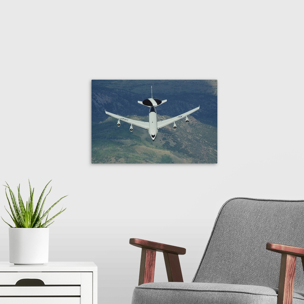 A modern room featuring A U.S. Air Force E-3 Sentry airborne warning and control system aircraft.
