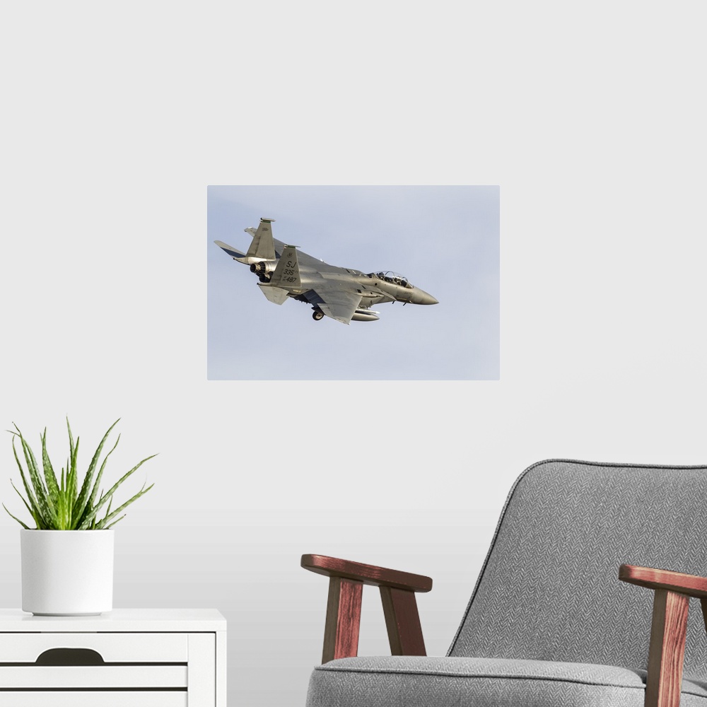 A modern room featuring A U.S. Air Force F-15E Strike Eagle.
