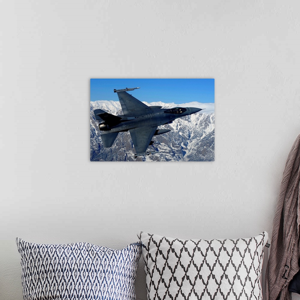 A bohemian room featuring A U.S. Air Force F-16 Fighting Falcon conducts operations over eastern Afghanistan.