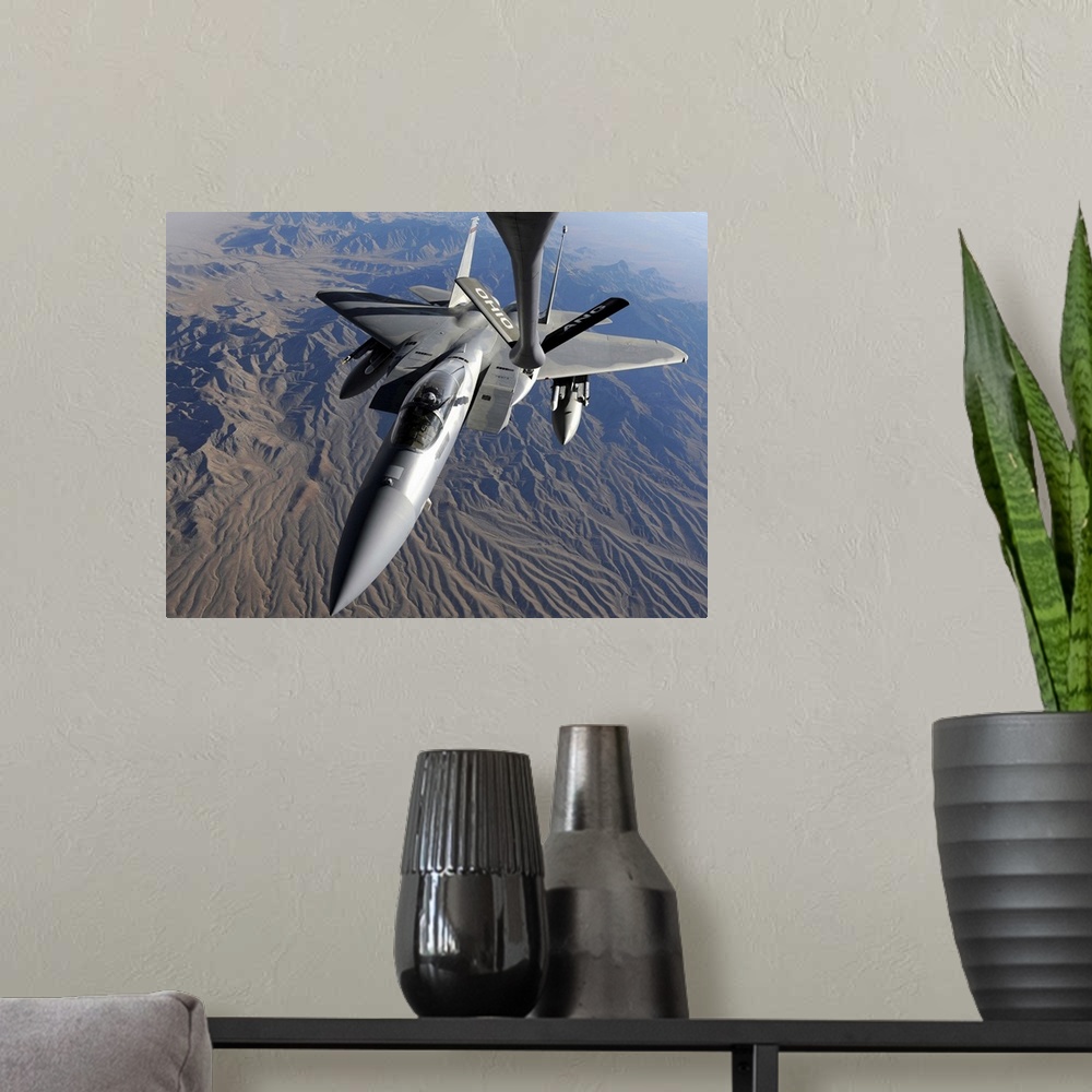 A modern room featuring A US Air Force F15 Eagle flies toward the boom of a KC135 Stratotanker