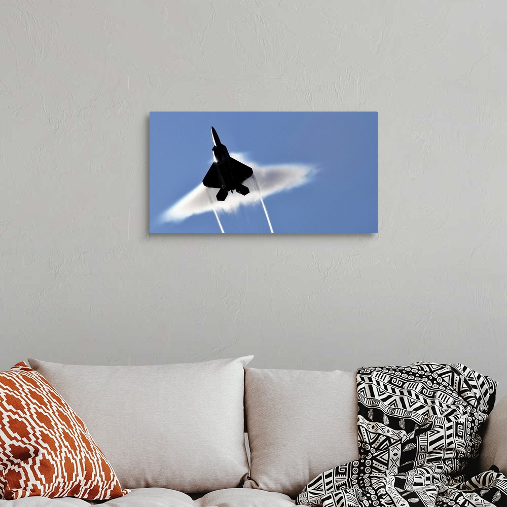 A bohemian room featuring A US Air Force F22 Raptor aircraft executing a supersonic flyby