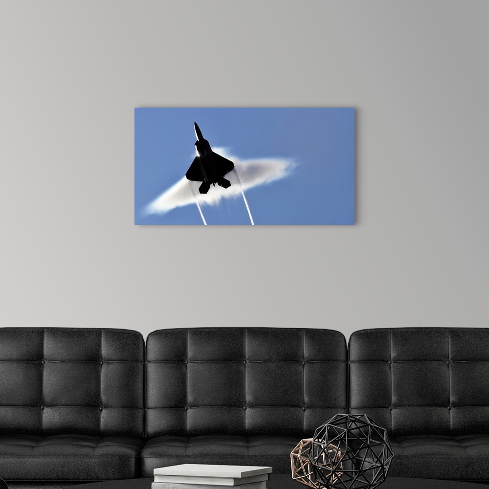 A modern room featuring A US Air Force F22 Raptor aircraft executing a supersonic flyby