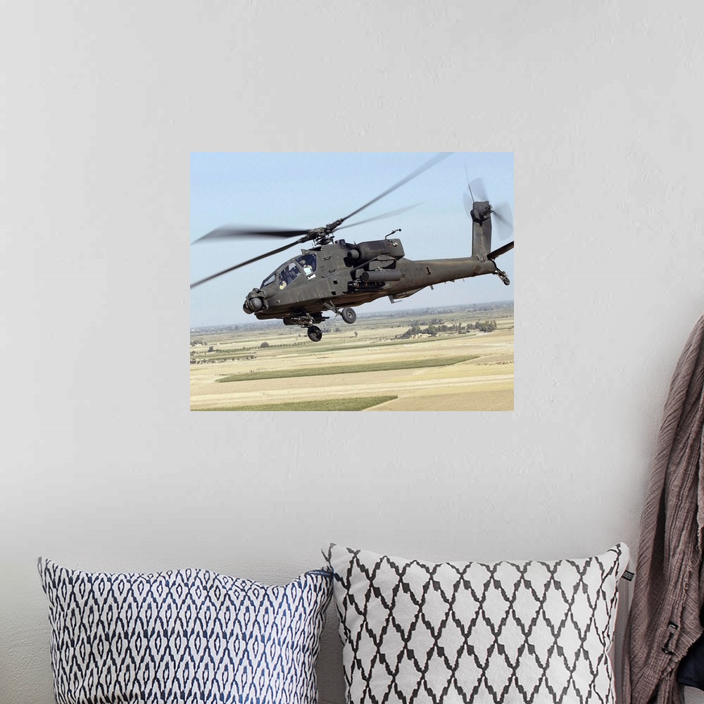 A bohemian room featuring A U.S. Army AH-64D Longbow Apache.