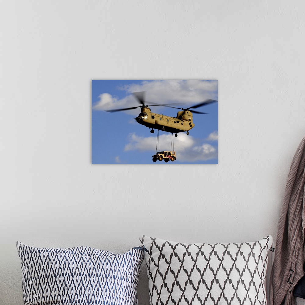 A bohemian room featuring March 4, 2010 - A U.S. Army CH-47 Chinook helicopter transporting a Humvee prepares to land at a ...