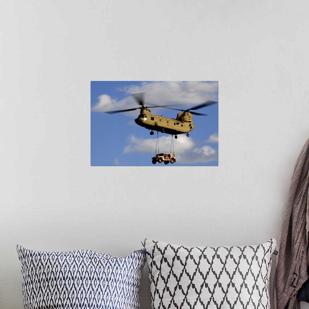 A bohemian room featuring March 4, 2010 - A U.S. Army CH-47 Chinook helicopter transporting a Humvee prepares to land at a ...