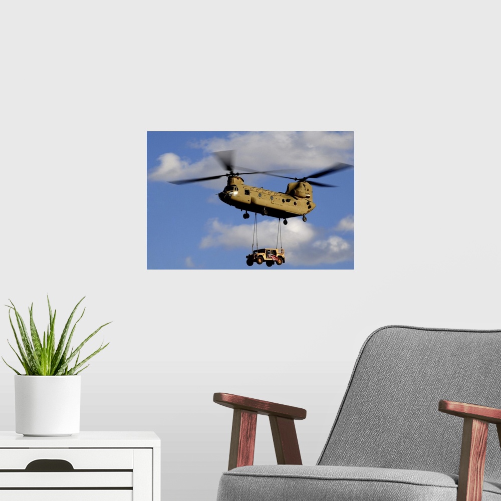 A modern room featuring March 4, 2010 - A U.S. Army CH-47 Chinook helicopter transporting a Humvee prepares to land at a ...