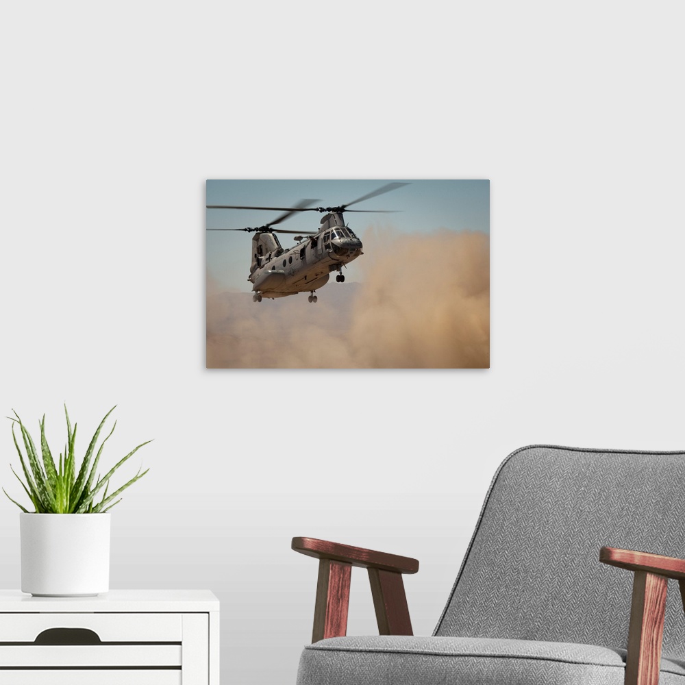 A modern room featuring A U.S. Marine Corps CH-46E Sea Knight helicopter begins to land.