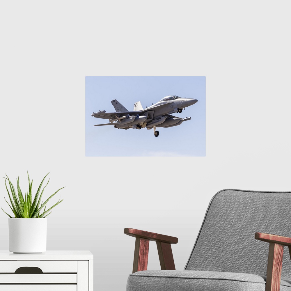 A modern room featuring A U.S. Navy E/A-18G Growler taking off from Nellis Air Force Base, Nevada.