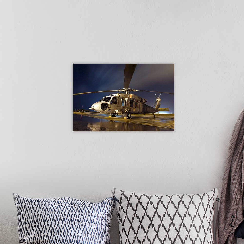 A bohemian room featuring A US Navy MH60S Seahawk helicopter
