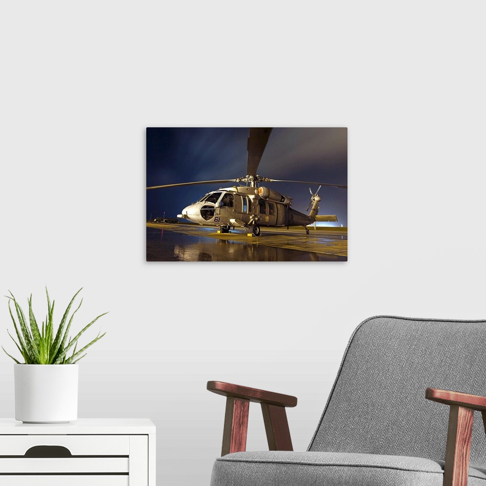 A modern room featuring A US Navy MH60S Seahawk helicopter