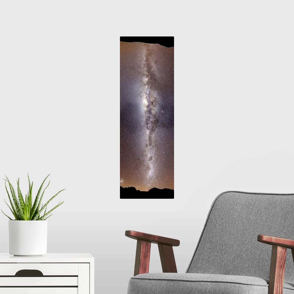 A modern room featuring A vertical panorama showing the Milky Way extending 180 degrees from horizon to horizon, Sierra d...