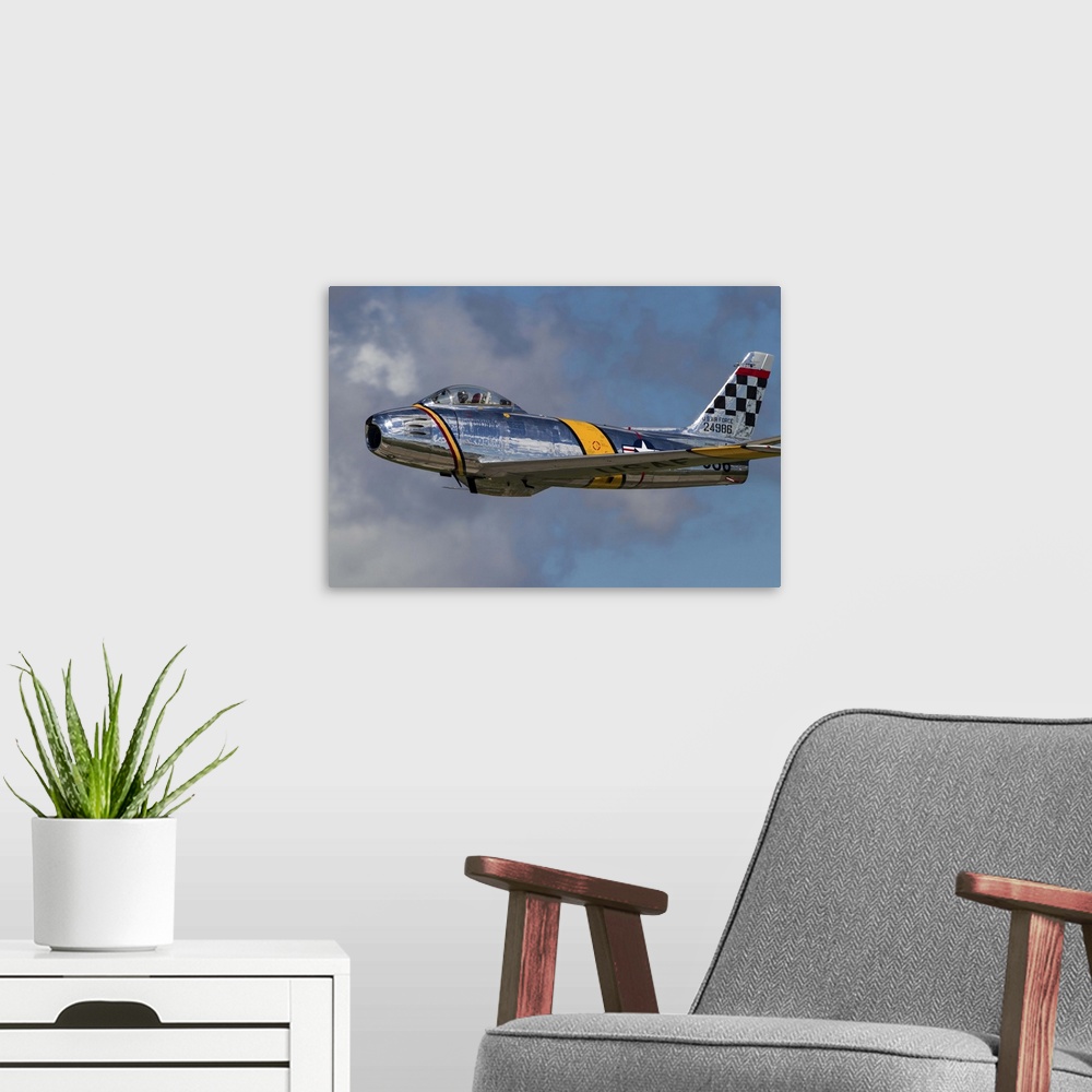 A modern room featuring A vintage F-86 Sabre of the Warbird Heritage Foundation takes off from Waukegan, Illinois.
