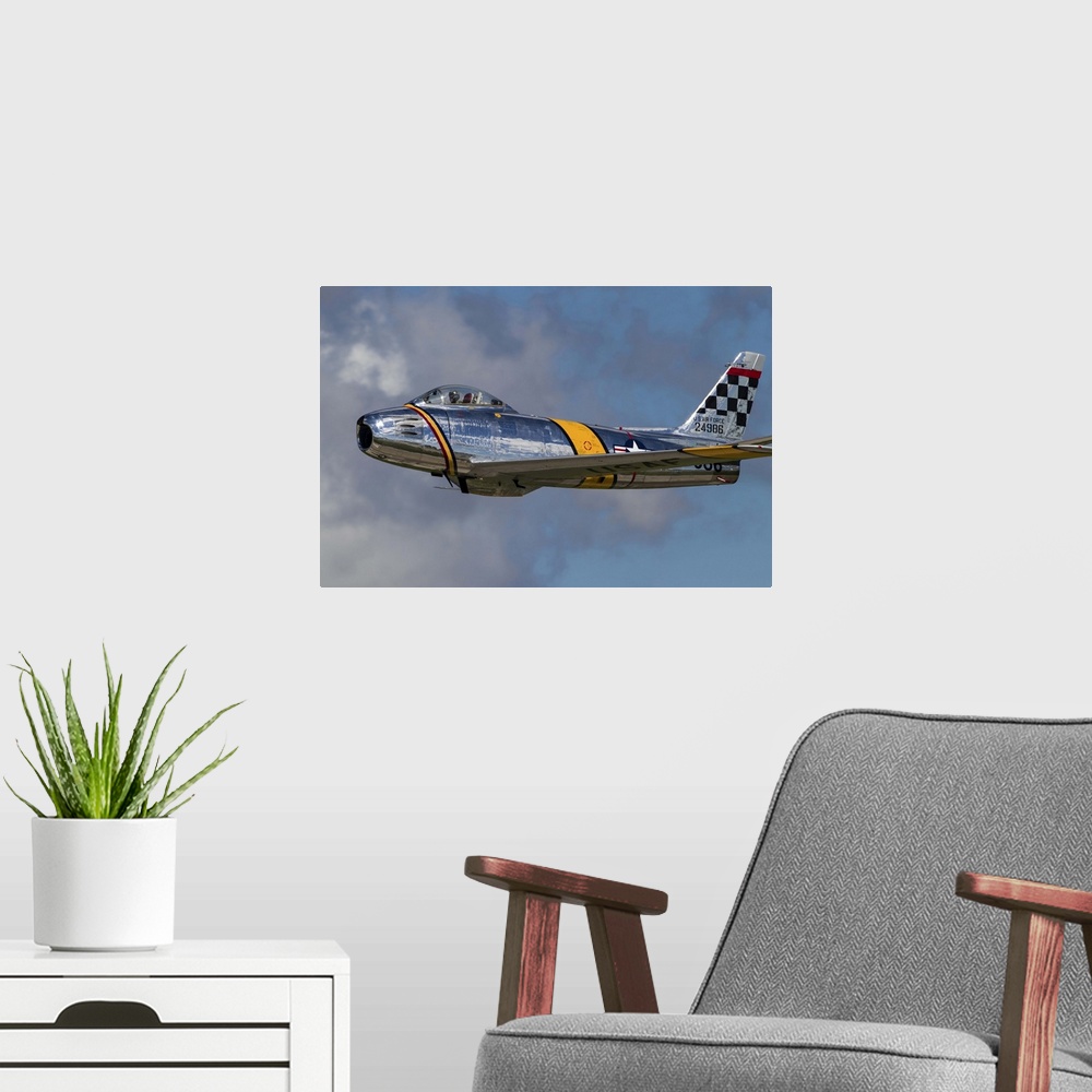 A modern room featuring A vintage F-86 Sabre of the Warbird Heritage Foundation takes off from Waukegan, Illinois.