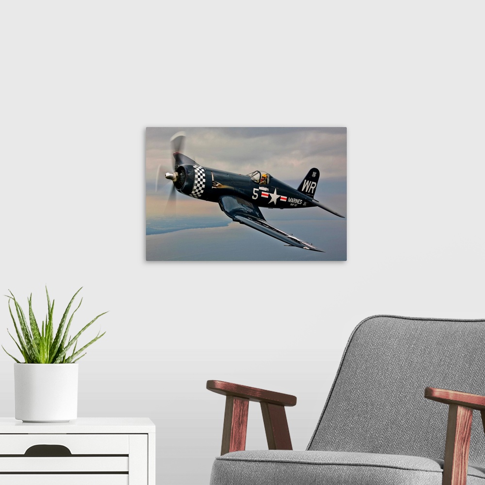 A modern room featuring A Vought F4U-5 Corsair in VMF-312 markings during the Korean War, flying over Oshkosh, Wisconsin.