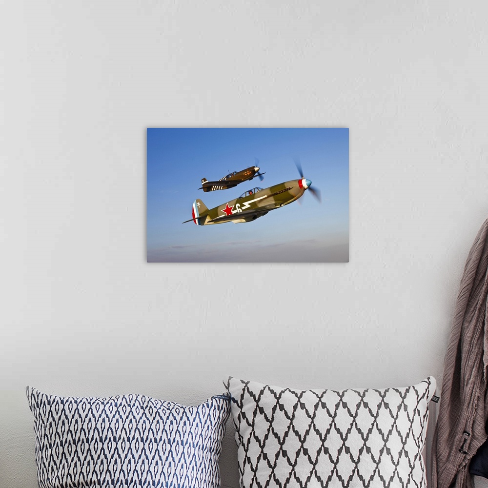 A bohemian room featuring A Yakovlev Yak-9 fighter plane and a North American P-51A Mustang in flight near Chino, California.