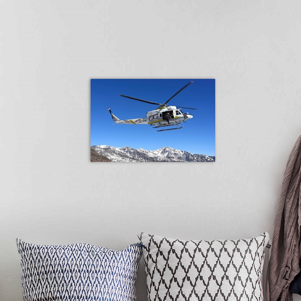 A bohemian room featuring AB.412 helicopter from Guardia di Finanza flying over the Alps.
