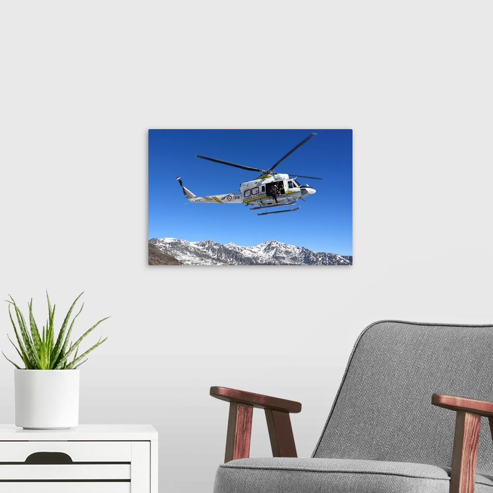 A modern room featuring AB.412 helicopter from Guardia di Finanza flying over the Alps.