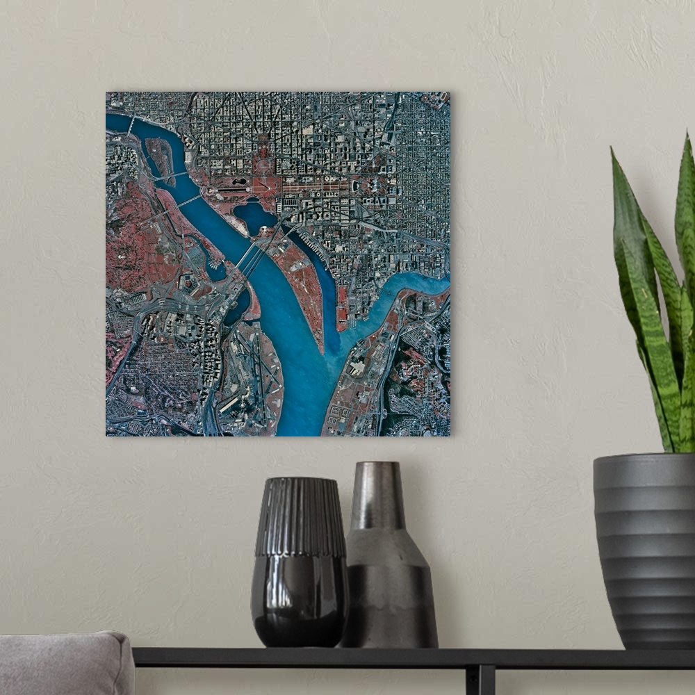 A modern room featuring Square large wall picture of a birds eye view of Washington DC, including the Potomac River.