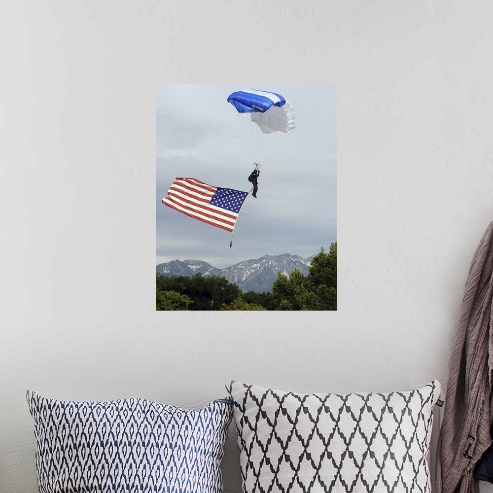 A bohemian room featuring Airman floats through the sky carrying the American flag.