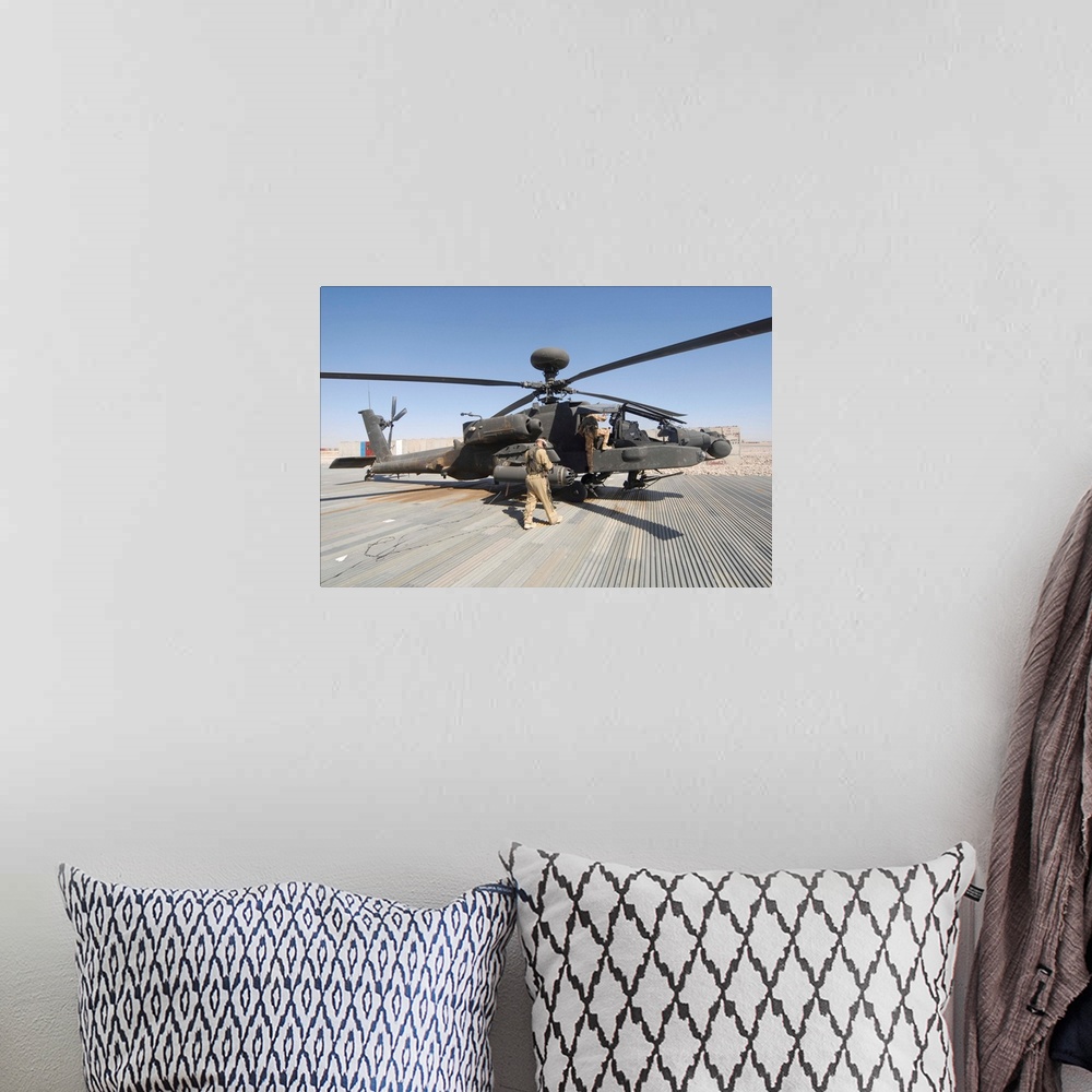 A bohemian room featuring Airmen board an Apache helicopter at Camp Bastion, Afghanistan.