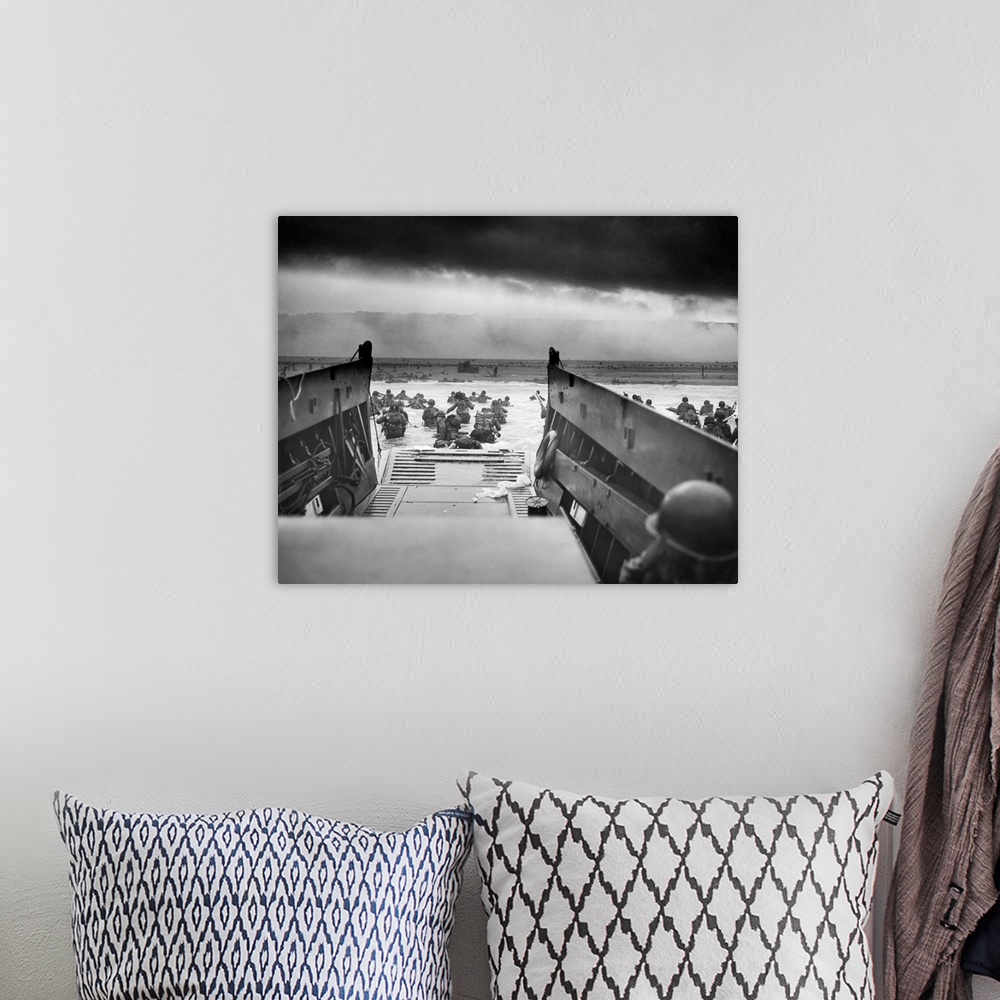 A bohemian room featuring Digitally restored vintage World War II photo of American troops wading ashore on Omaha Beach dur...