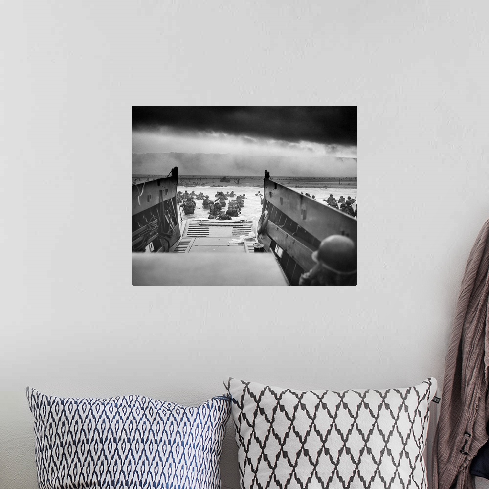 A bohemian room featuring Digitally restored vintage World War II photo of American troops wading ashore on Omaha Beach dur...