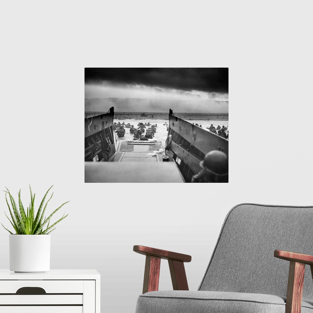 A modern room featuring Digitally restored vintage World War II photo of American troops wading ashore on Omaha Beach dur...