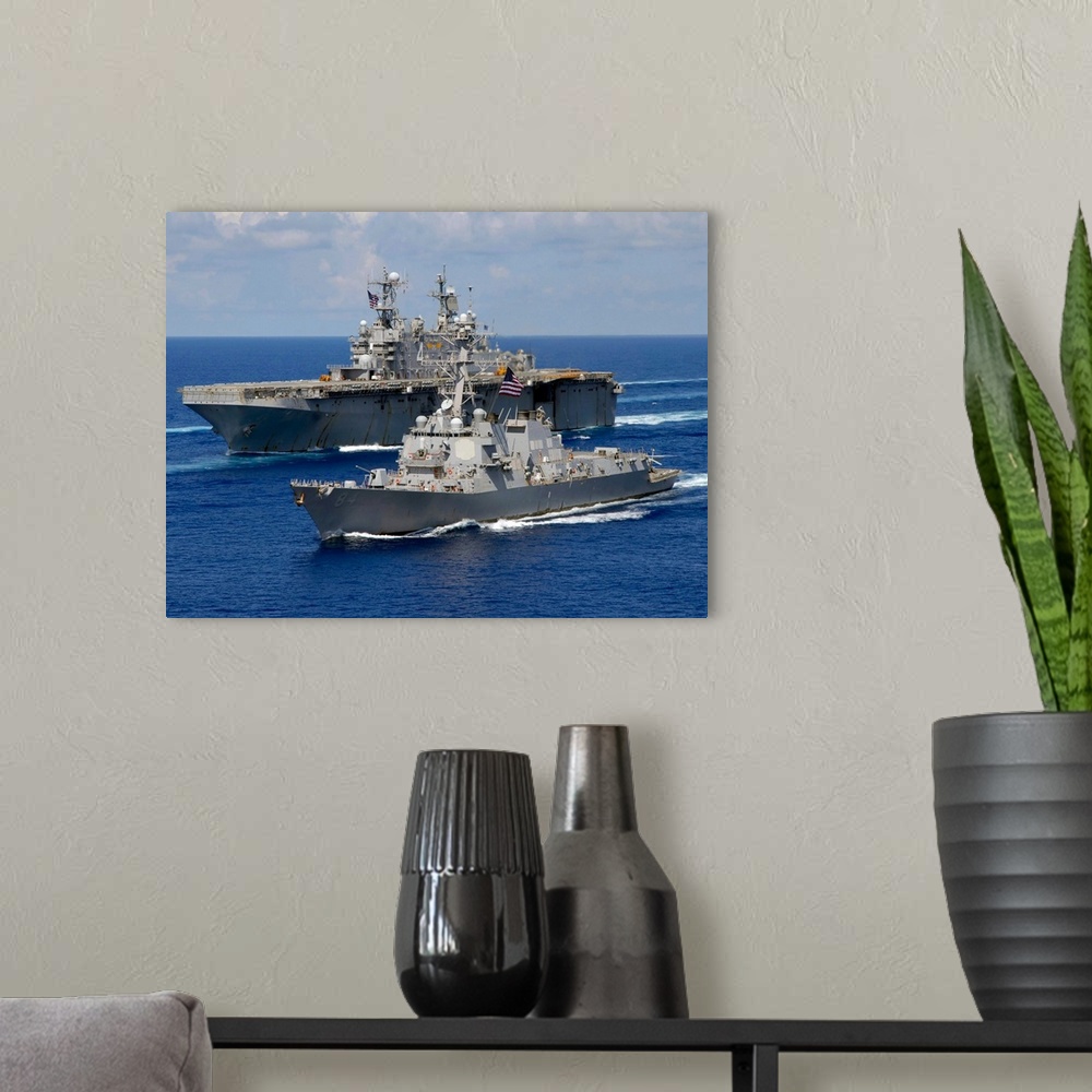 A modern room featuring Amphibious assault ship USS Nassau and guided missile destroyer USS Bulkeley transit the Atlantic...