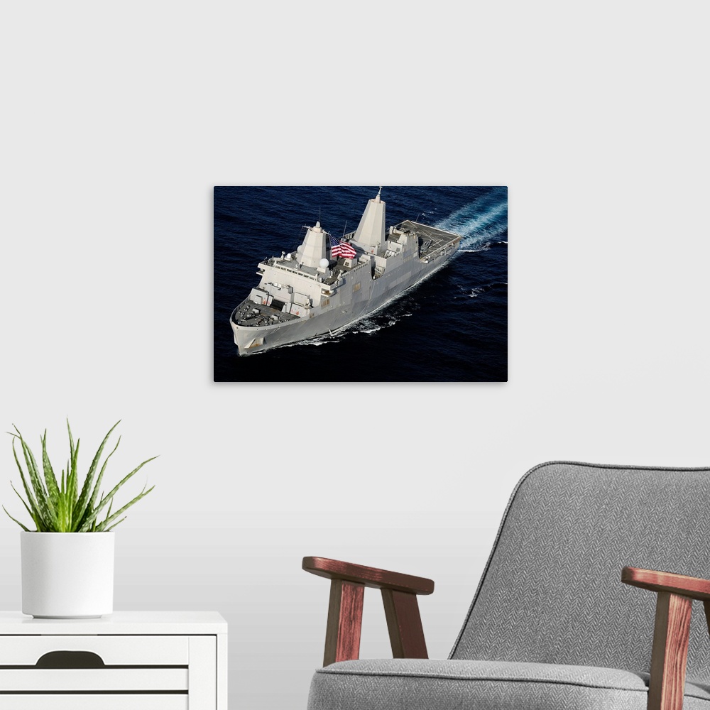 A modern room featuring Amphibious transport dock ship USS San Antonio transiting the Gulf of Aden.