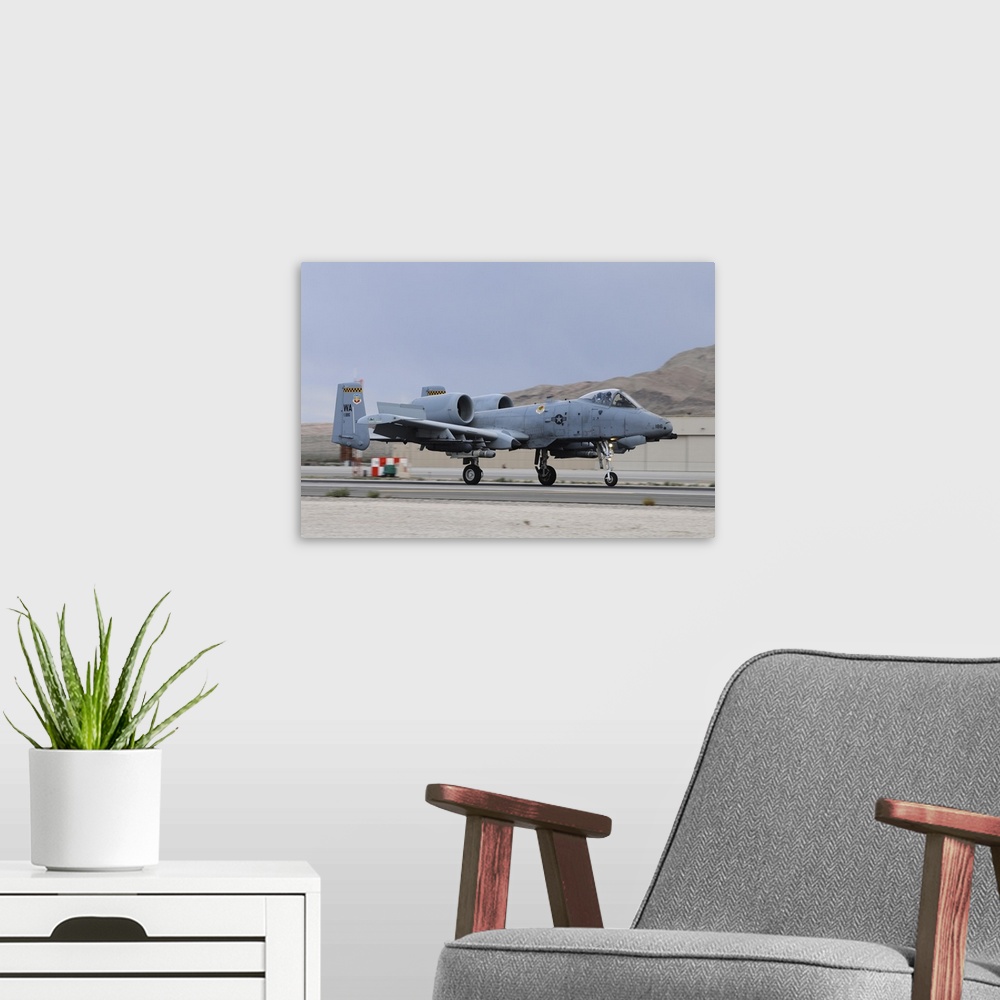 A modern room featuring An A-10C Thunderbolt II landing at Nellis Air Force Base, Nevada.