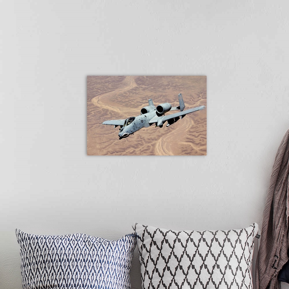 A bohemian room featuring This United States Air Force aircrafted also known as a oWarthogo or oHogo A twin-engine jet desi...